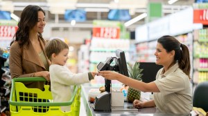 handing over loyalty card at supermarket