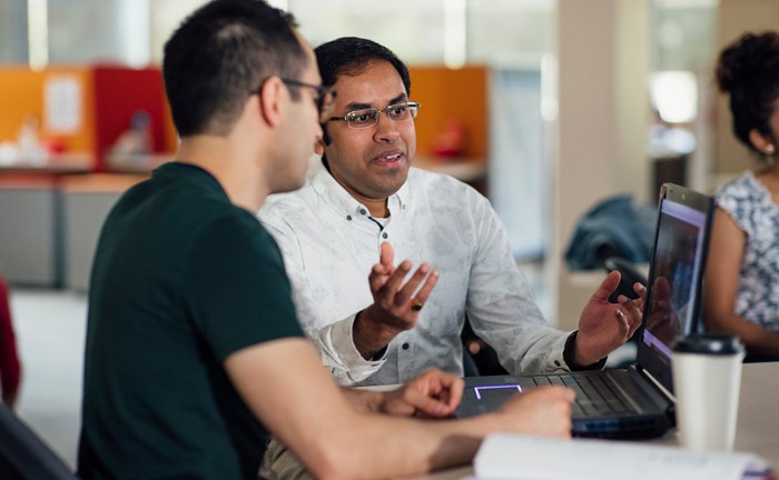 student_at_uni_in_class_with_laptop