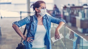 woman at airport cancelled travel