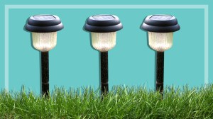 three garden lights on grass