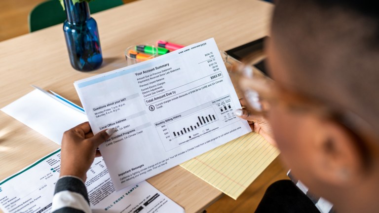 woman thinking of switching to small energy provider