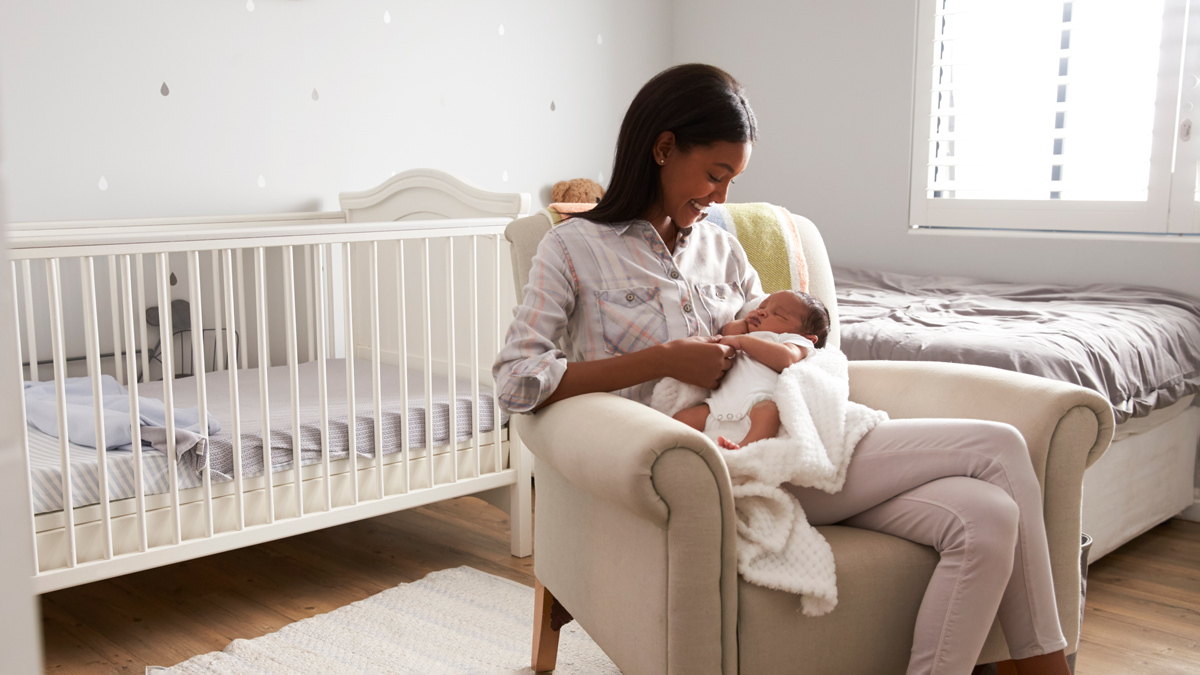 woman sitting in nursery at home