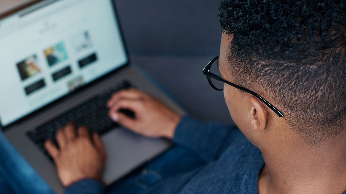 person shopping online on laptop