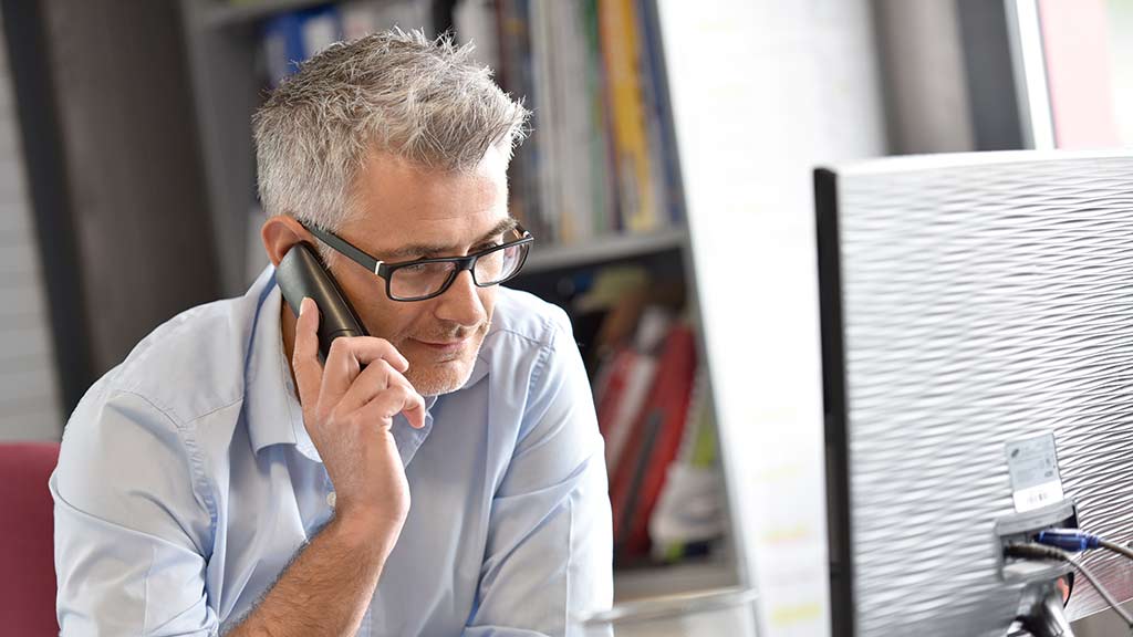 older man on phone choice help