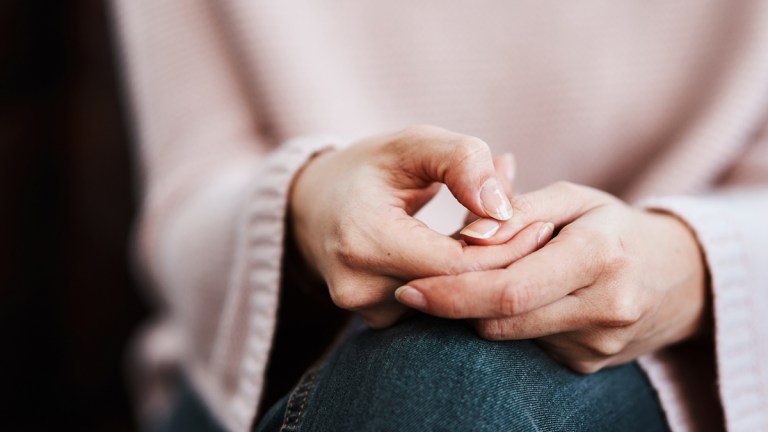woman_with_hands_in_lap