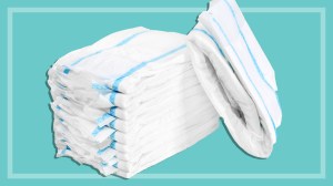 white incontinence pads on a teal background