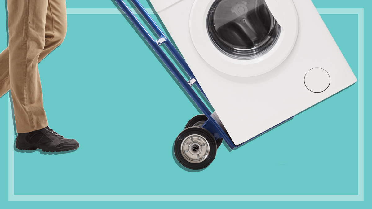 person using a trolley to move a washing machine
