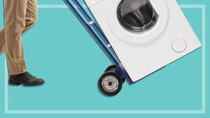 person using a trolley to move a washing machine