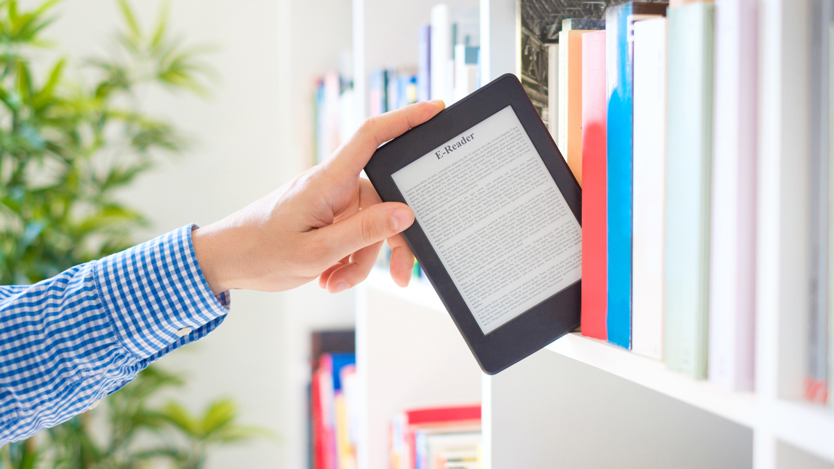 pulling ereader from bookshelf