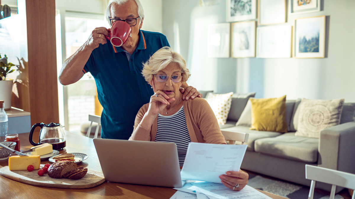 couple looking at super fund papers
