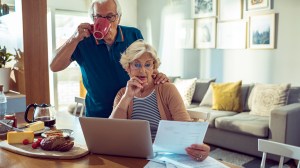 couple looking at super fund papers