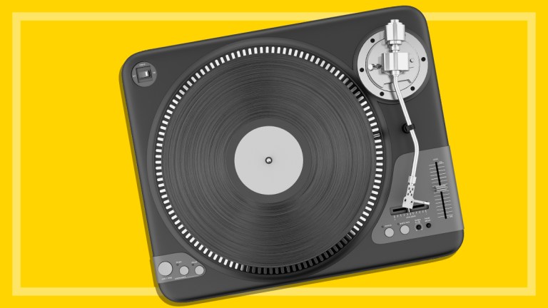 black record player on a yellow background