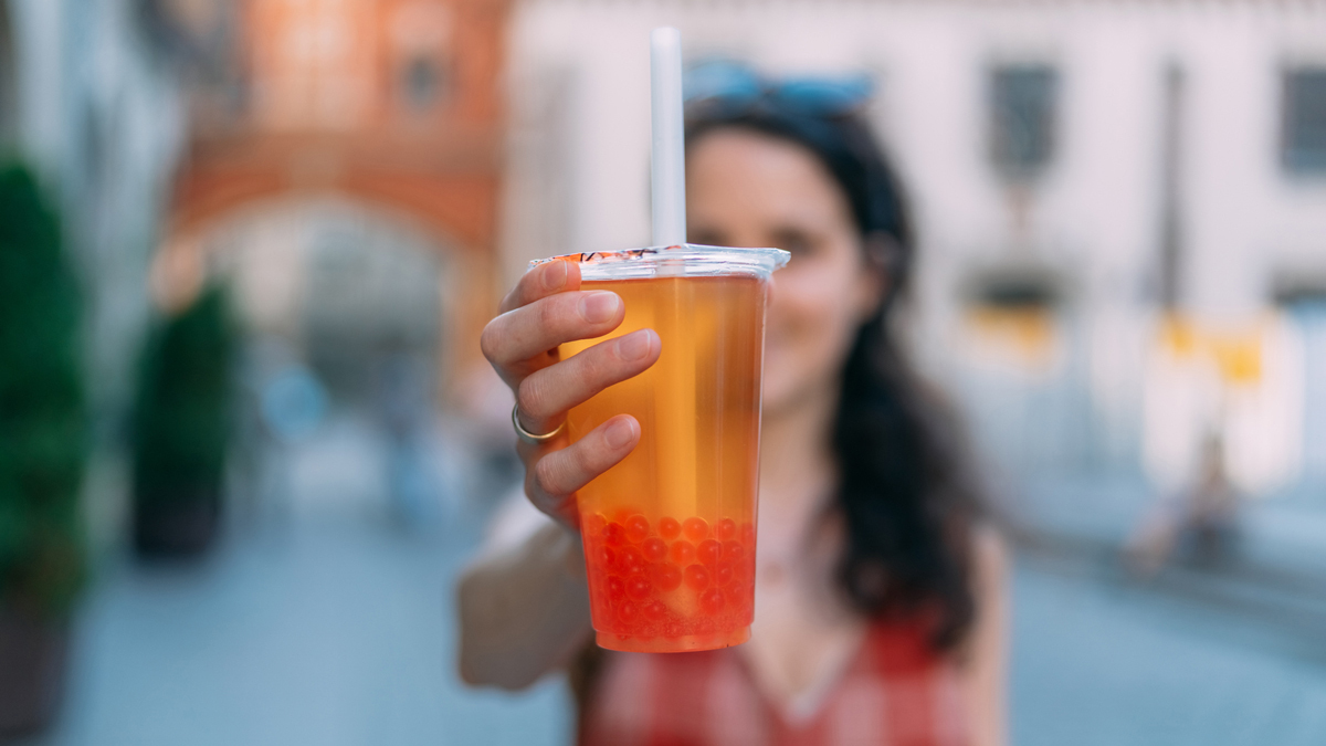 woman holding a bubble tea