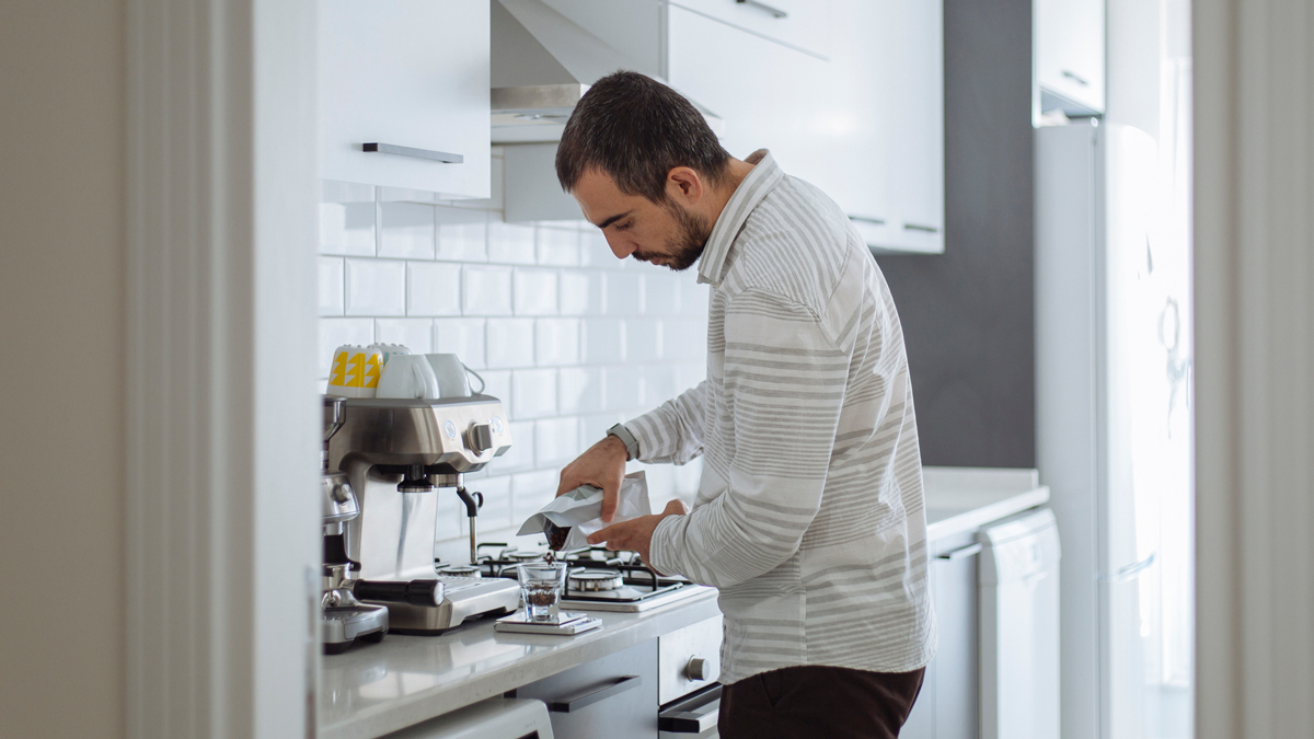 man making coffee at home