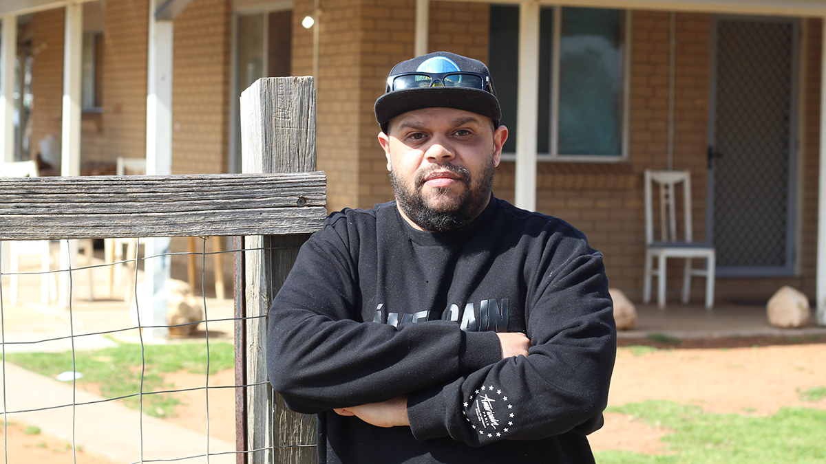 charles johnson in front of his mothers home