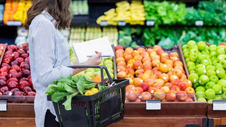 woman shopping for fruit and veg supermarket