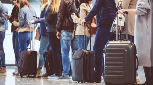 long_queue_of_people_waiting_to_board_or_check-in_for_flight