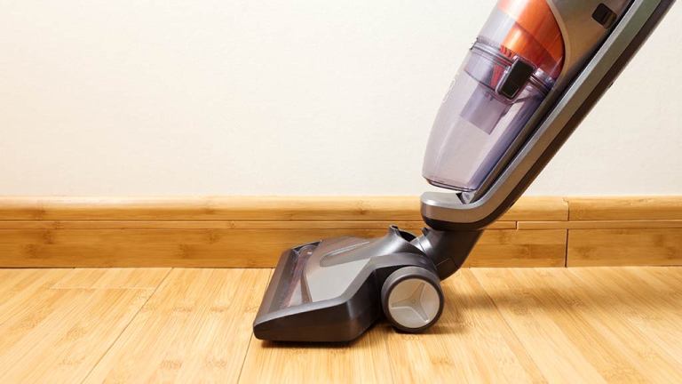 stick vacuum on wooden floor