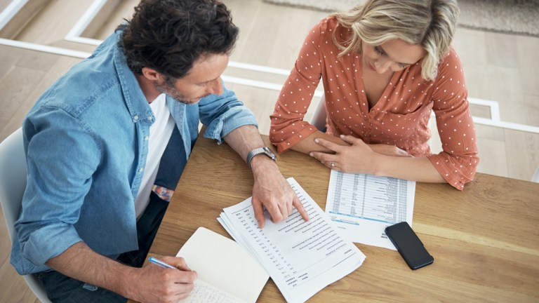 couple looking at insurance documents