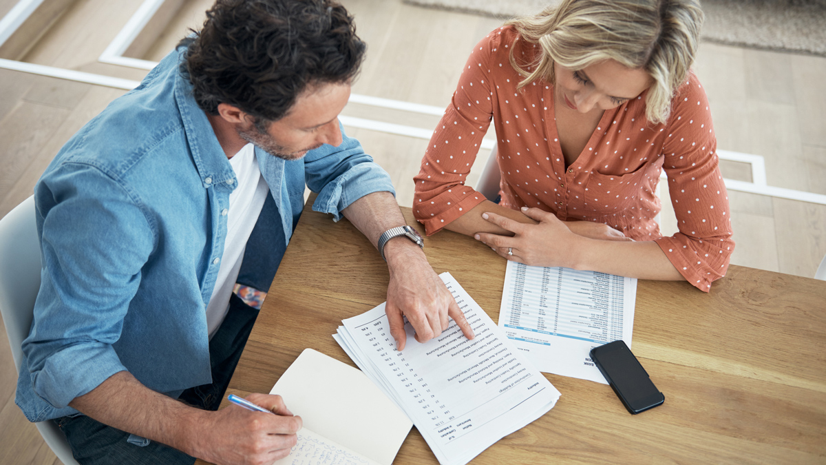 couple looking at insurance documents