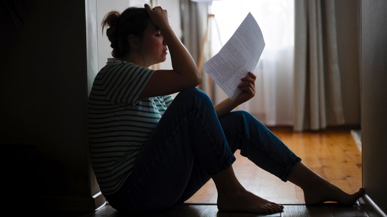 distressed_tenant_reading_eviction_notice