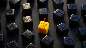 an arrow hitting a yellow target