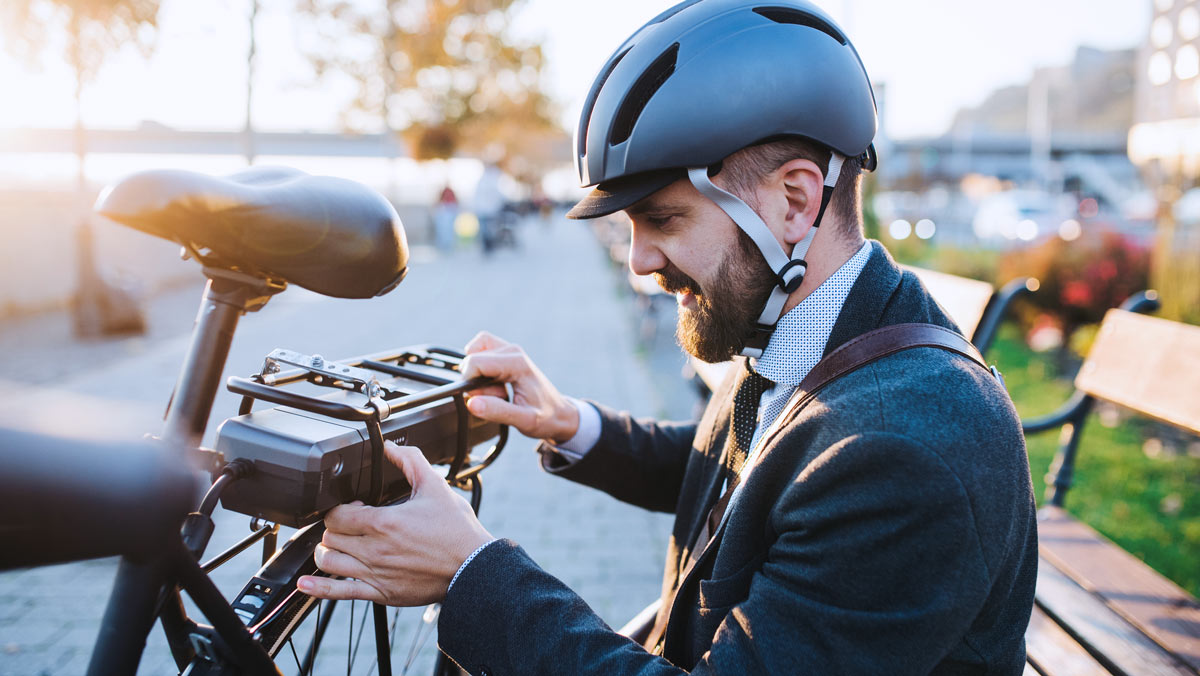 man looking at electric bicycle