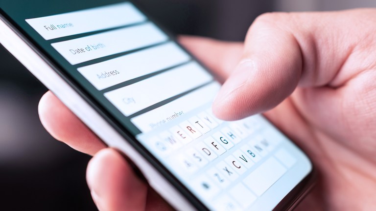 person entering their details into webform on smartphone