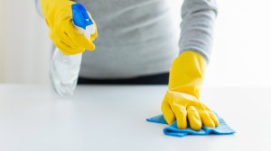 person using multi purpose cleaners lead