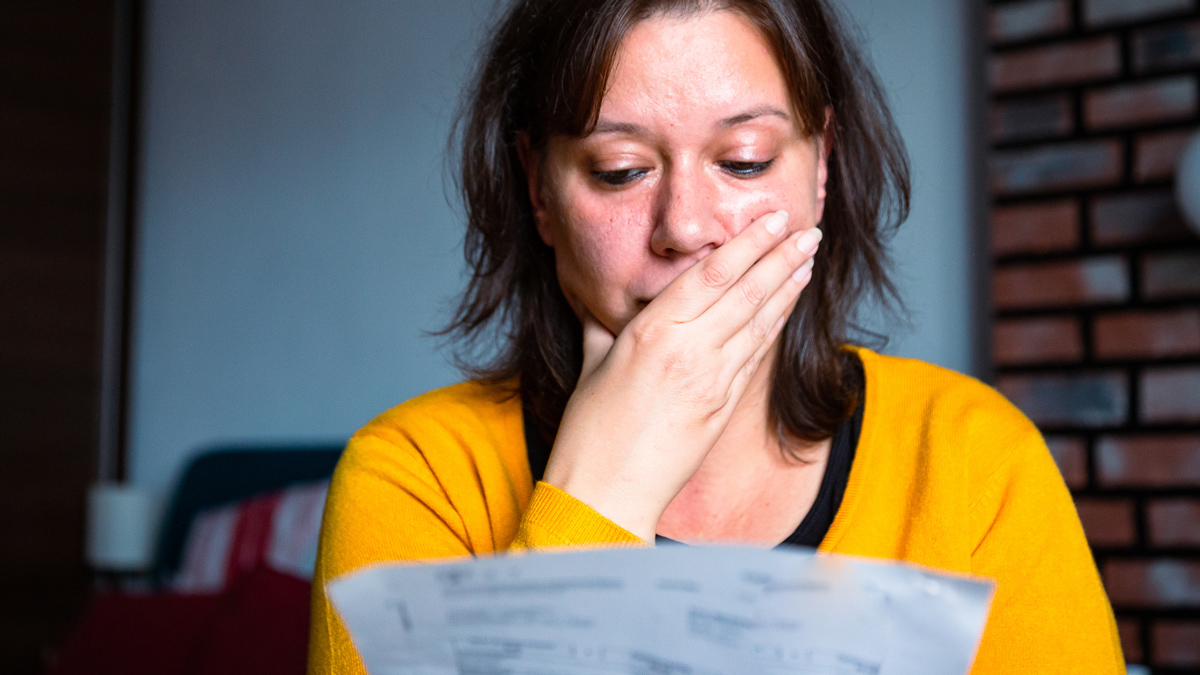 woman looking at energy bill