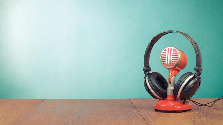 over ear headphones on a vintage microphone