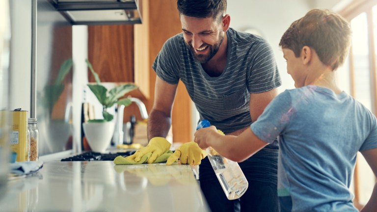 father and son spring cleaning