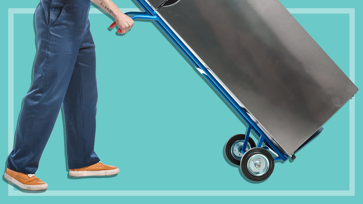 person moving fridge with trolley