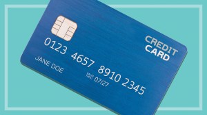 a dark blue credit card with fake numbers and the name Jane Doe on a teal background