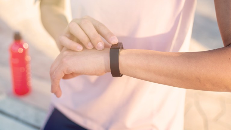 person checking their fitness tracker