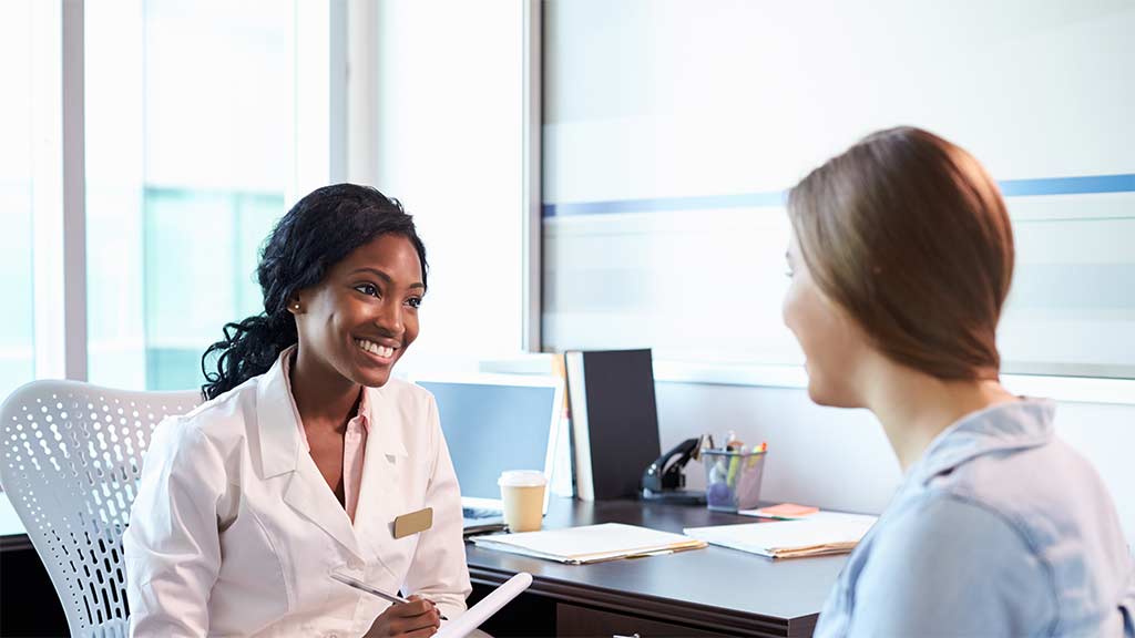 surgeon consulting with patient