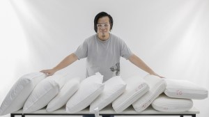 choice tester matthew tung standing behind a row of pillows