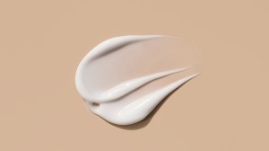 swatch of sunscreen on brown background