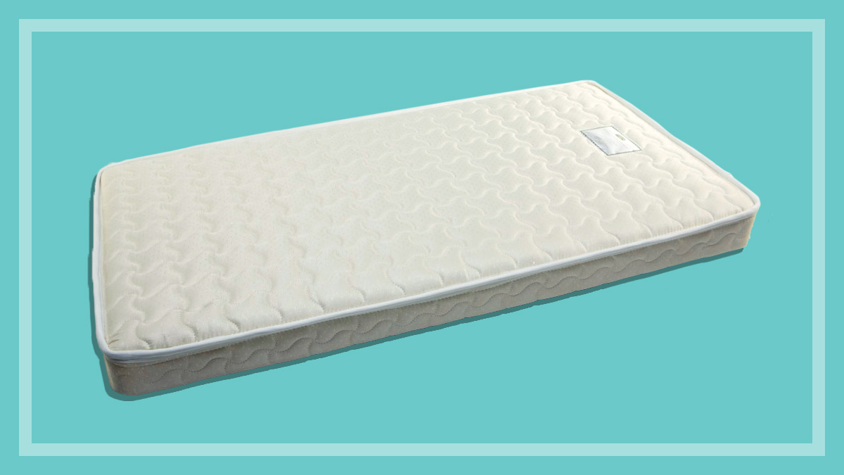 cot mattress on a green background