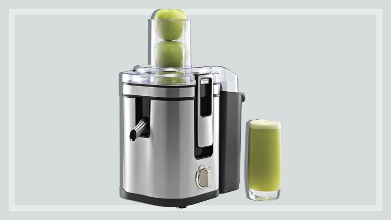 juicer with glass of apple juice