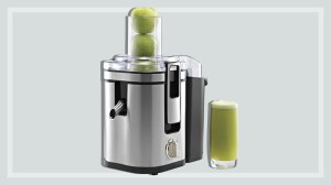 juicer with glass of apple juice