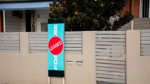 for lease sign with leased sticker in front of an australian rental home