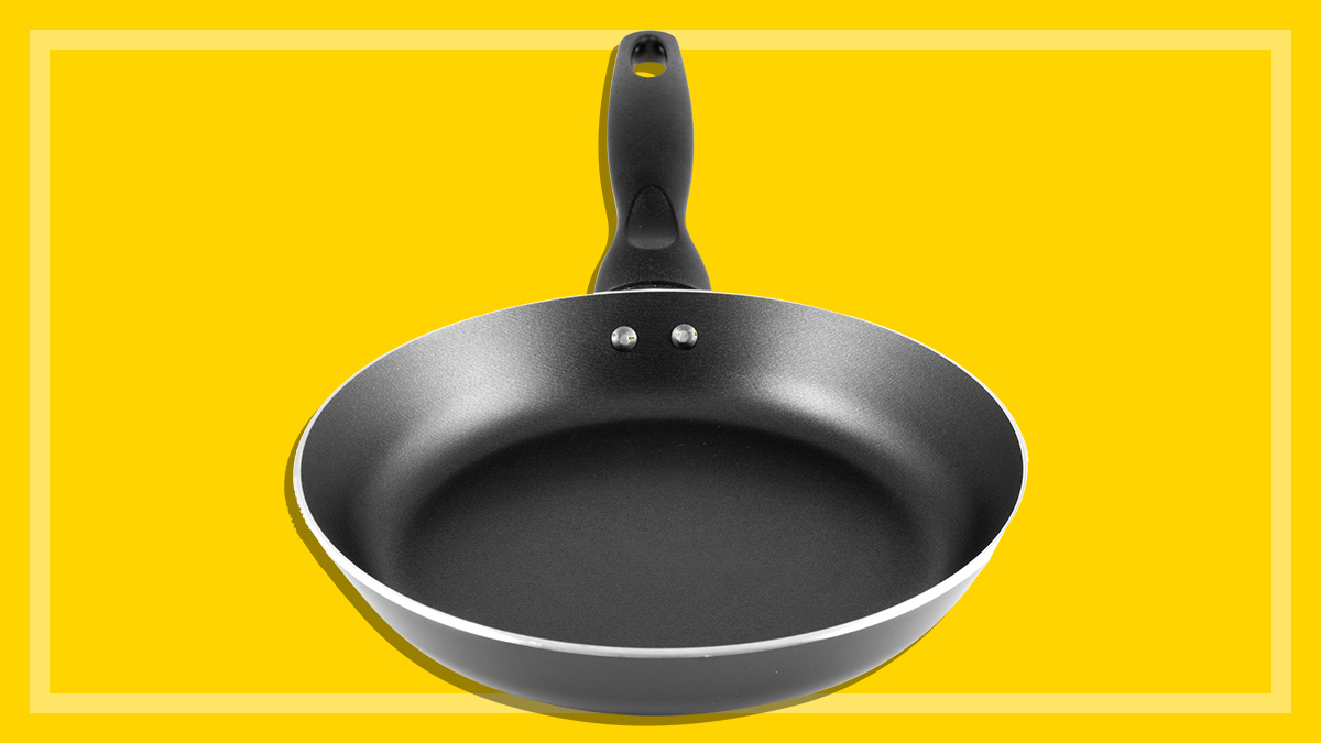 non-stick frying pan on a yellow background
