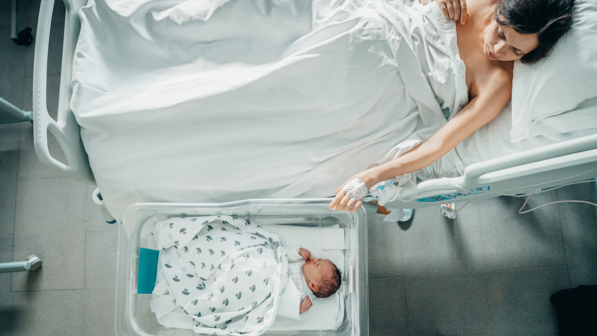 woman and newborn baby in hospital