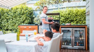 cooking_in_outdoor_kitchen_bbq_bar_fridge