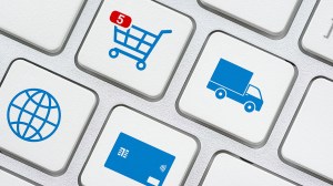 keyboard showing online shopping and delivery symbols