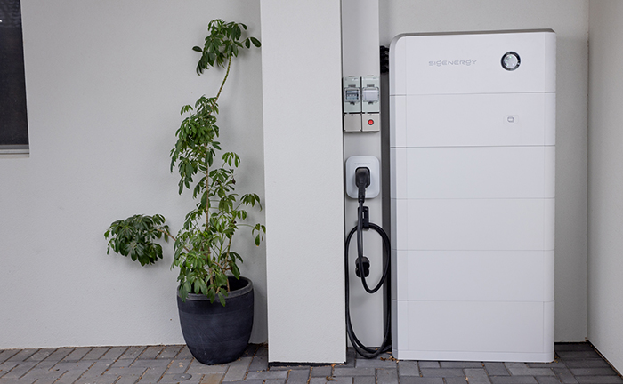 solar battery next to outside wall of home