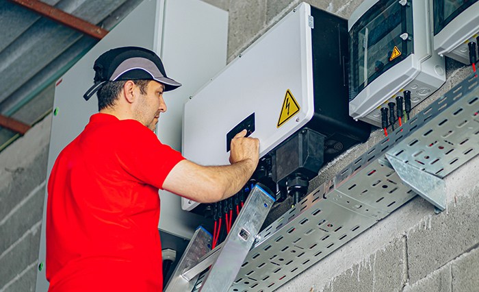 technician setting up solar energy system