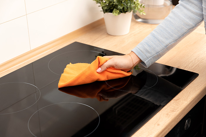 wiping induction cooktop with microfibre cloth