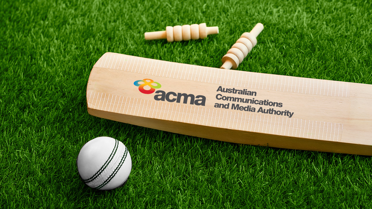 Acma logo on cricket bat with ball and bails